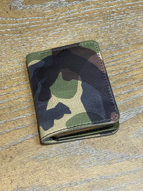8 pocket bifold wallet with camouflage outer shell and solid Pueblo inner pockets.