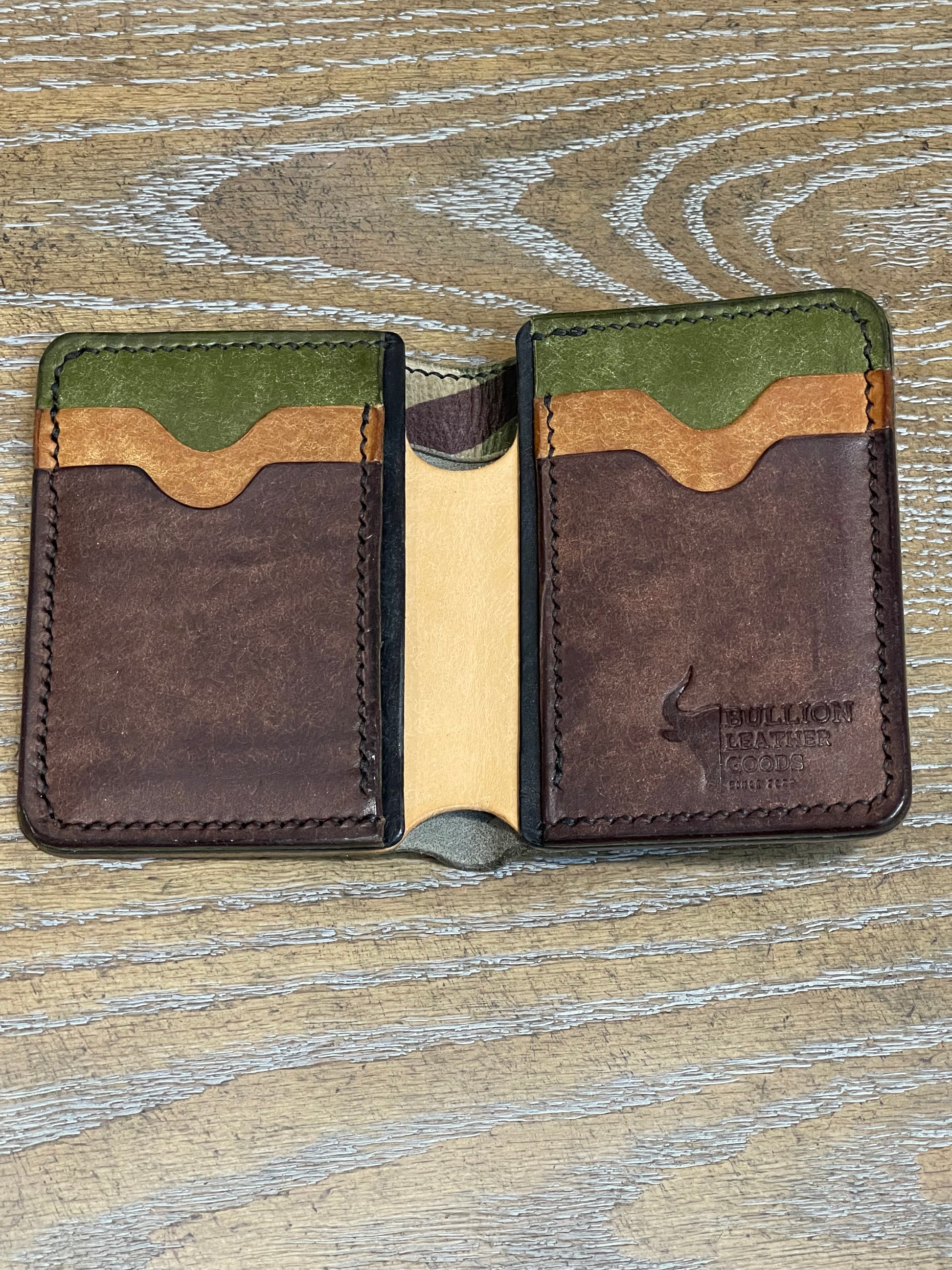 8 pocket bifold wallet with camouflage outer shell and solid Pueblo inner pockets.